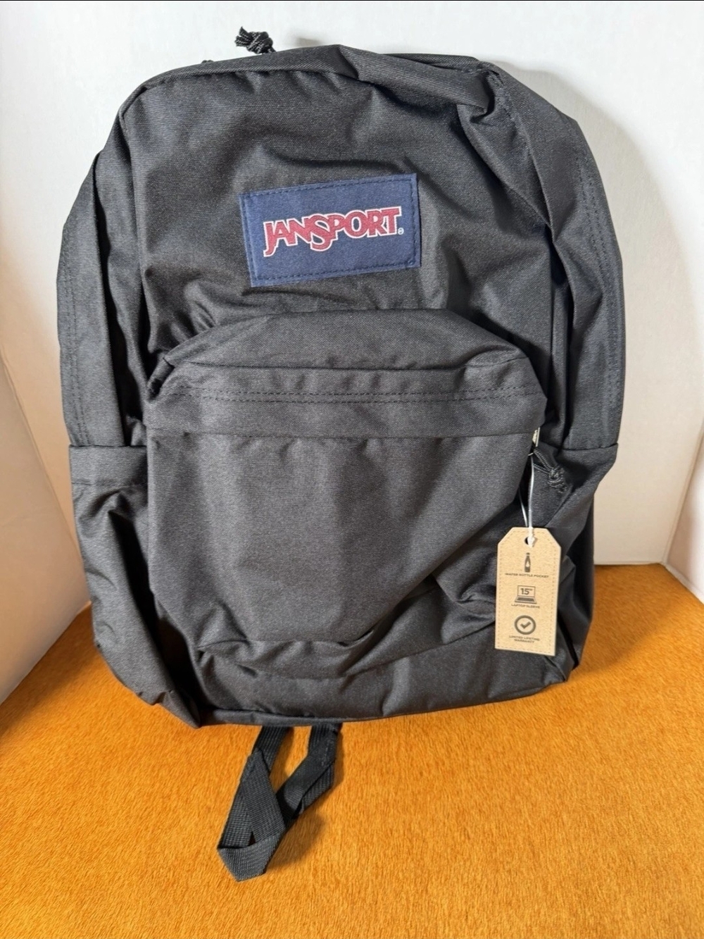 Jansport Black Backpack with Navy Patch and Red Logo